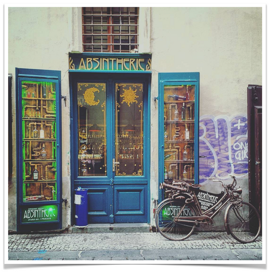Absinthe bar in Old Town Prague. Art nouveau style. A bicycle is propped against a door.